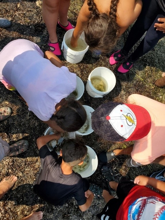 Youth participants engaged in a hands-on outdoor science activity during the inaugural 2021 camp