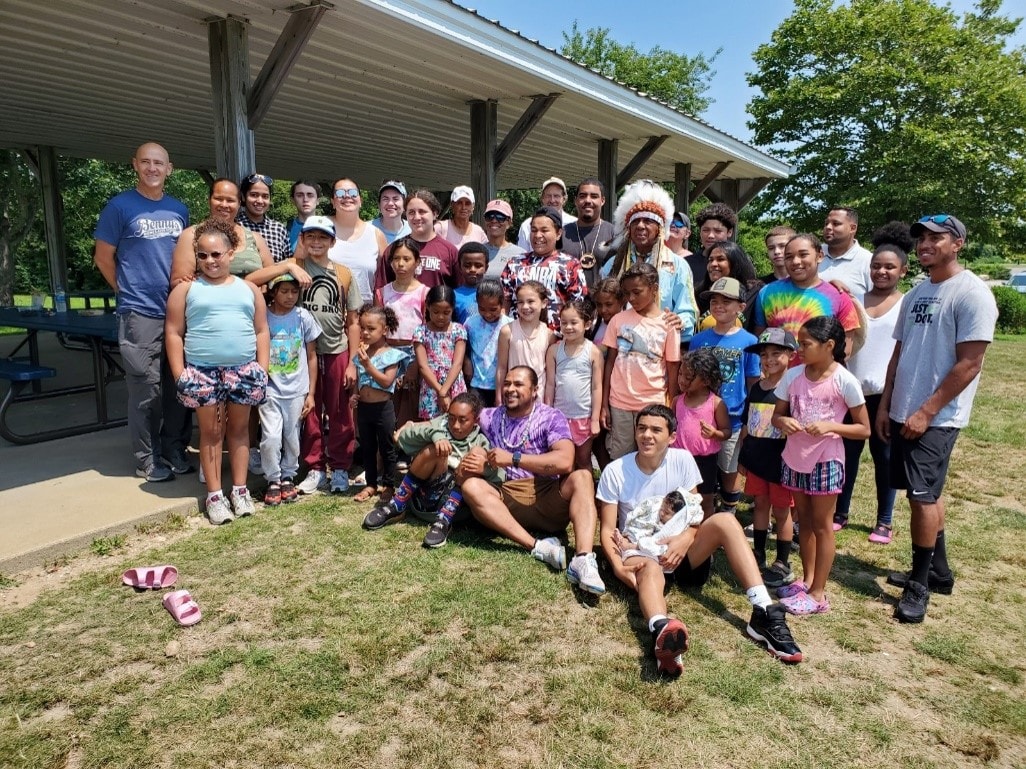 Group photo from the inaugural Indigenous STEM RI camp at Ninigret Park, July 2021 — youth, families, and community members gathered under a pavilion